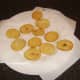 Potato discs are drained on kitchen paper
