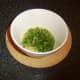 Coriander/cilantro is stirred in to beaten eggs