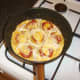 Cheese is melted over the top of the tortilla