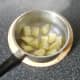 Boiled potatoes are left to steam and cool