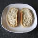 Horseradish sauce is spread evenly over bread