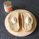 Horseradish sauce is spooned on to bread