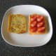 Sliced strawberries are added to smoked salmon