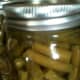 The processed green beans will continue to bubble inside. This is completely normal for pressure canning.