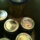 Lifting the jars out of the canner.