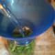 Adding boiling water to the jars of fresh green beans. Be sure to leave 1 inch of head space.