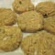 Salmon patties are placed on waxed paper ready to fry.