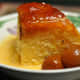 Steamed Cumquat Marmalade Pudding served with Warm Custard Sauce and Brandied Cumquats. Image: &copy; Siu Ling Hui