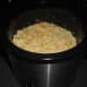 Pour the macaroni and cheese mixture into a medium-sized crock pot.