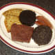 Meat and tattie scones are plated for all day Scottish breakfast