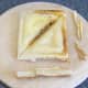 Haggis and cheese toasted sandwich is trimmed for service