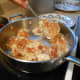 Lift hash browns on spatula and quickly turn to a 90 degree angle to the pan.