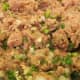 Ground turkey mixture is prepared carefully to form meatballs that will be tender, juicy, and flavorful.