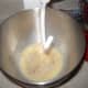 Pour it into a mixer bowl that has the dough hook attachment ready and add the yeast.  Wait a few minutes for the yeast to bubble.