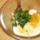 Turmeric, mayo and coriander are added to hard boiled egg
