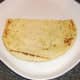 Half naan bread is plated