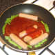 Spicy szechuan tomato sauce is added to sausages and beans