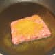 Frying curried Lorne sausage