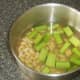 Celery and cannellini beans added to turkey stock