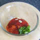 Mixing spicy tomato dip for placie fillets