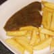 Chips are plated with plaice fillet