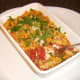 Tucking in to plaice fish and pasta bake