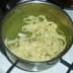 Cooked tagliatelle is added to pea and mint sauce