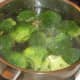 Broccoli is simmered in boiling salted water