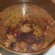 Red wine and stock are added to sealed beef