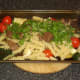 Venison, pasta and parsley added to roasted vegetables