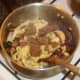 Tagliatelle and venison are added to sauteed vegetblaes