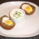 Haggis Scotch duck egg is plated with dip