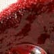 Using the back of a spoon, gently push the liquid through a fine sieve into a bowl. Discard the seeds and pulp.