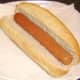 Hot dog is added to sub roll