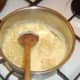 Macaroni added to cheese sauce