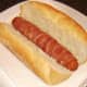 Bacon dog is laid in sub roll
