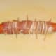 Bacon wrapped dog ready for deep frying