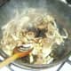 Soy sauce is added to stir fried cabbage and kidneys