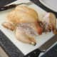 Leg portions are cut from roast chicken