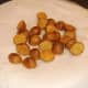 Draining pan roasted potatoes