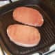 Starting to griddle bacon medallion steaks