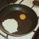 Starting to fry deconstructed egg
