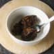 Christmas pudding is heated in microwave oven