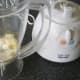 Preparing to blend pineapple and cheese