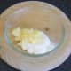Squeezed pineapple is added to cream cheese