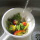 Mediterranean salad is washed in cold water
