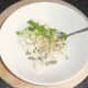 Combining and seasoning conger eel, onion and parsley