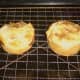 Puff pastry steak pies are rested on wire rack