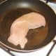 Starting to fry seasoned turkey breast fillet
