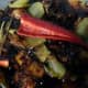 13. Finally add in the cut chili and stir for another minute. Ayam Masak Kicap Pedas or Spicy Soy Sauce Chicken dish is now ready to serve.